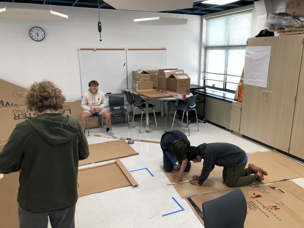 Transportation Systems Class getting ready for Cardboard Boat Races in the pool. Putting Archimedes Principle to work. 